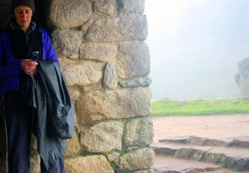 Texting at Machu Picchu, near Cusco, Peru
