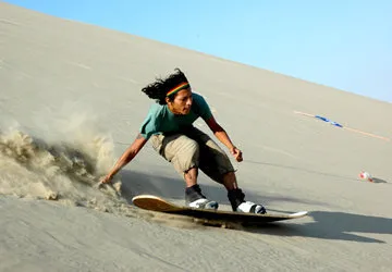 Sandboarding White Hill sand dune near Ica, Peru