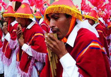 Traditional Sikuri musicians playing Andean panpipes in Puno