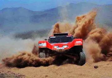 Trailing dust clouds towards the Dakar Rally finish in Lima,