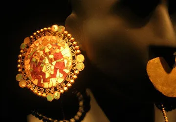 Inlaid golden ear and nose plugs from the Moche civilization