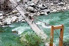 Crossing a hanging bridge while hiking the Choquequirao to M