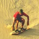 Sandboarding near Huacachina Oasis near Nazca, Peru