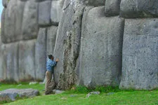 Tourist at the Inca Fortress of Sacsayhuaman in Cusco, Peru.