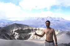 Hiker in front of the crater at the top of El Misti in Arequ