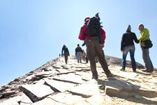 Tourists tackling Mt Chacaltaya, overlooking La Paz, Bolivia
