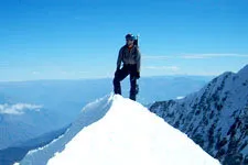 Climber on the snowy summit of Huayna Potosi near La Paz, Bo