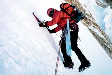 Man scaling snowy Mount Huayna Potosi near La Paz, Bolivia.