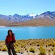 Young trekker by Condoriri Lake in the Chacapampa Valley in 
