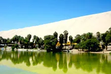 Huacachina Lagoon in the desert by Ica, Peru.