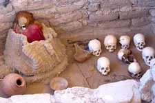 Mummy, skulls, and relics in Chauchilla Cemetery in Nazca, P