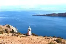 Woman looking over Lake Titicaca from Sun Island in Bolivia.