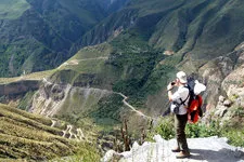 Trekker at Condor lookout in Colca Canyon near Arequipa, Per