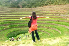 Girl visiting the Moray Inca archeological site near Cusco, 