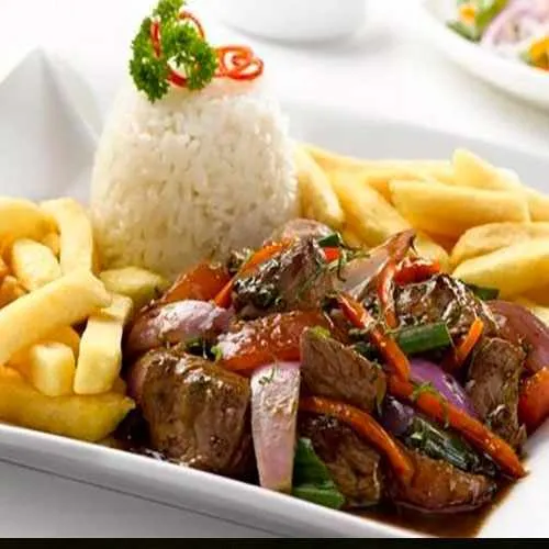 Cover Photo. Plate of Lomo Saltado from dinner show in Lima,