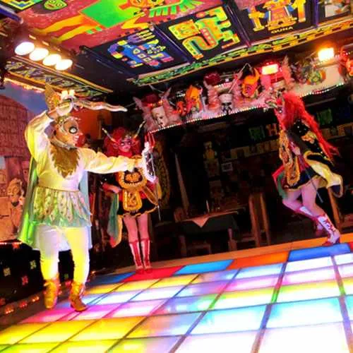 Cover photo. La Paz traditional peña with folkloric dance