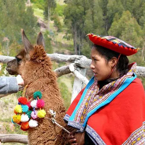 Cover Photo. Traditionally dressed weaver in the Sacred Vall